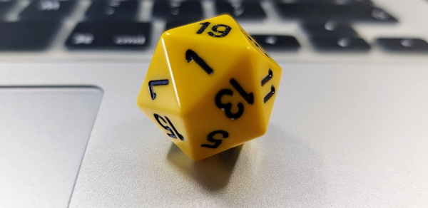 20-sided dice on a laptop