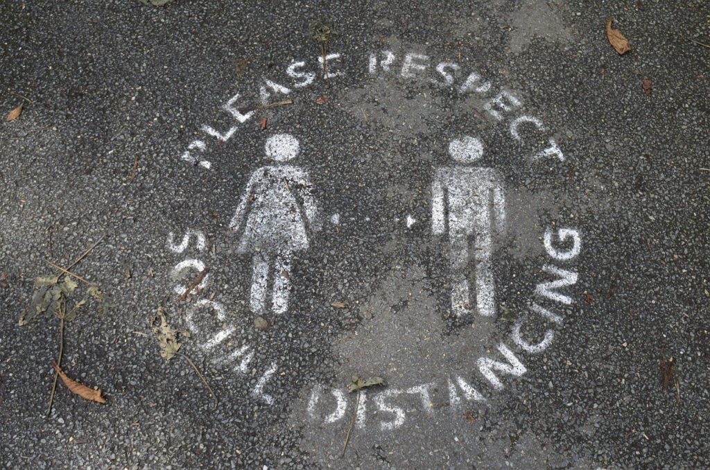 social distancing stencil on ground