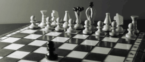 A black and white image of a game of chess