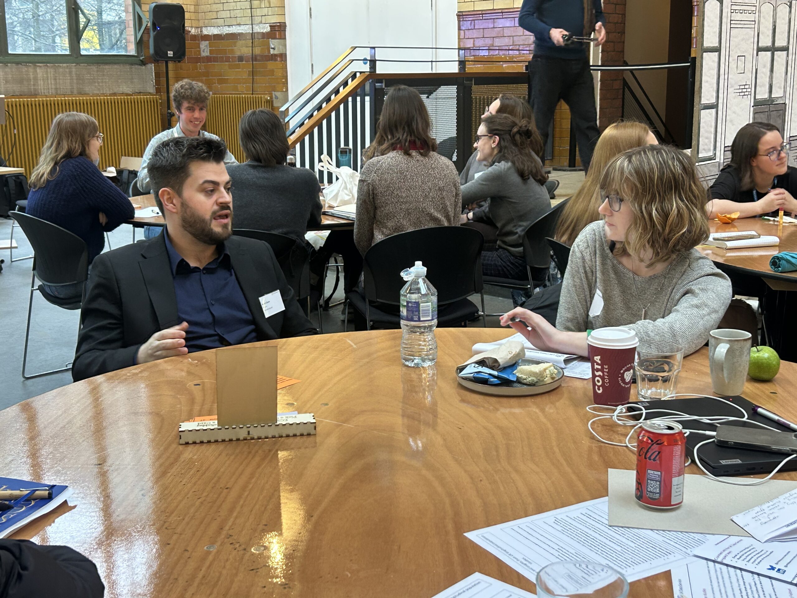 Adam Davis talking to attendee